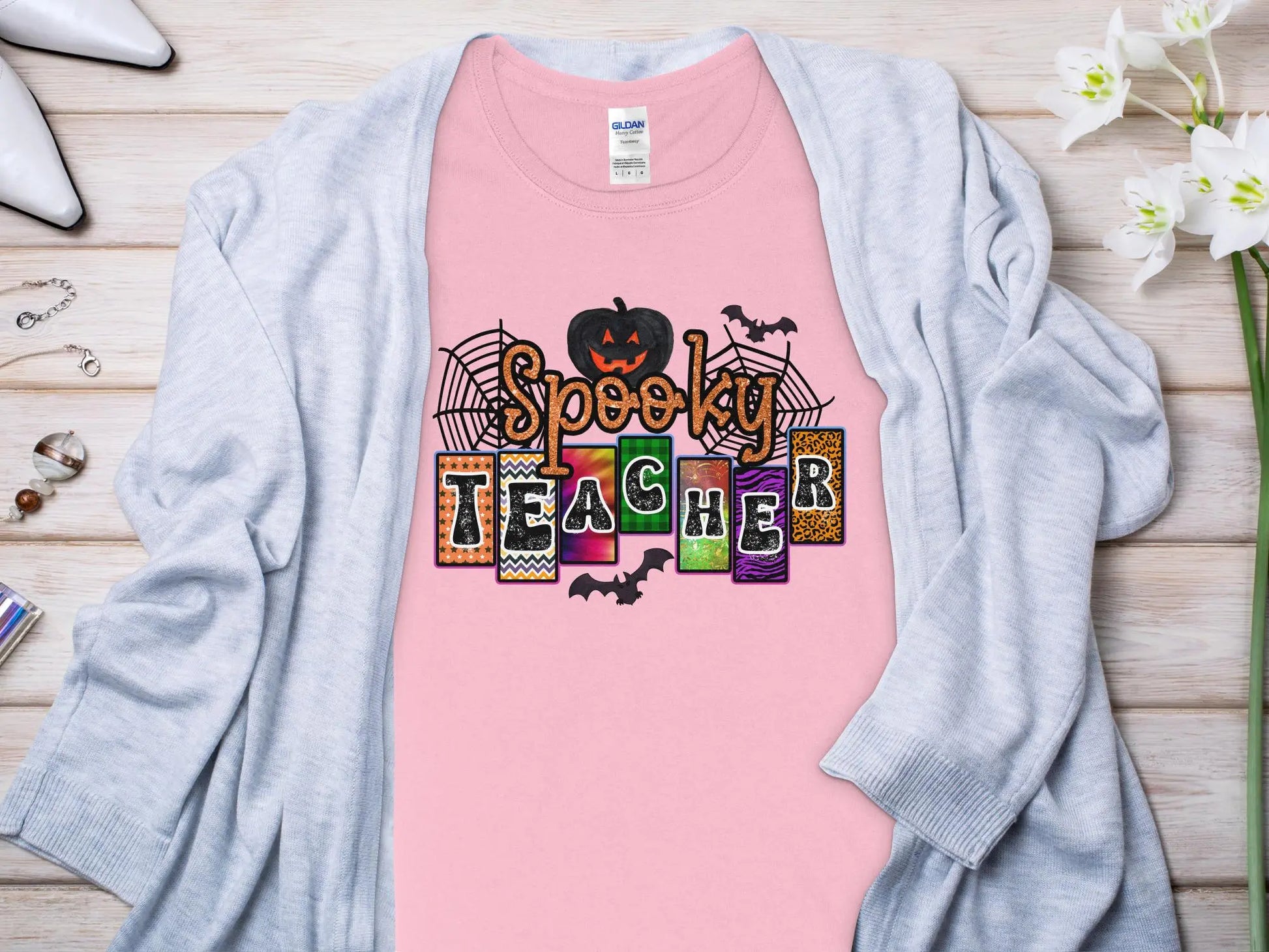 This Halloween Teacher T-Shirt is crafted from high-quality fabric in sizes to fit all shapes and size - Creations Unlimited