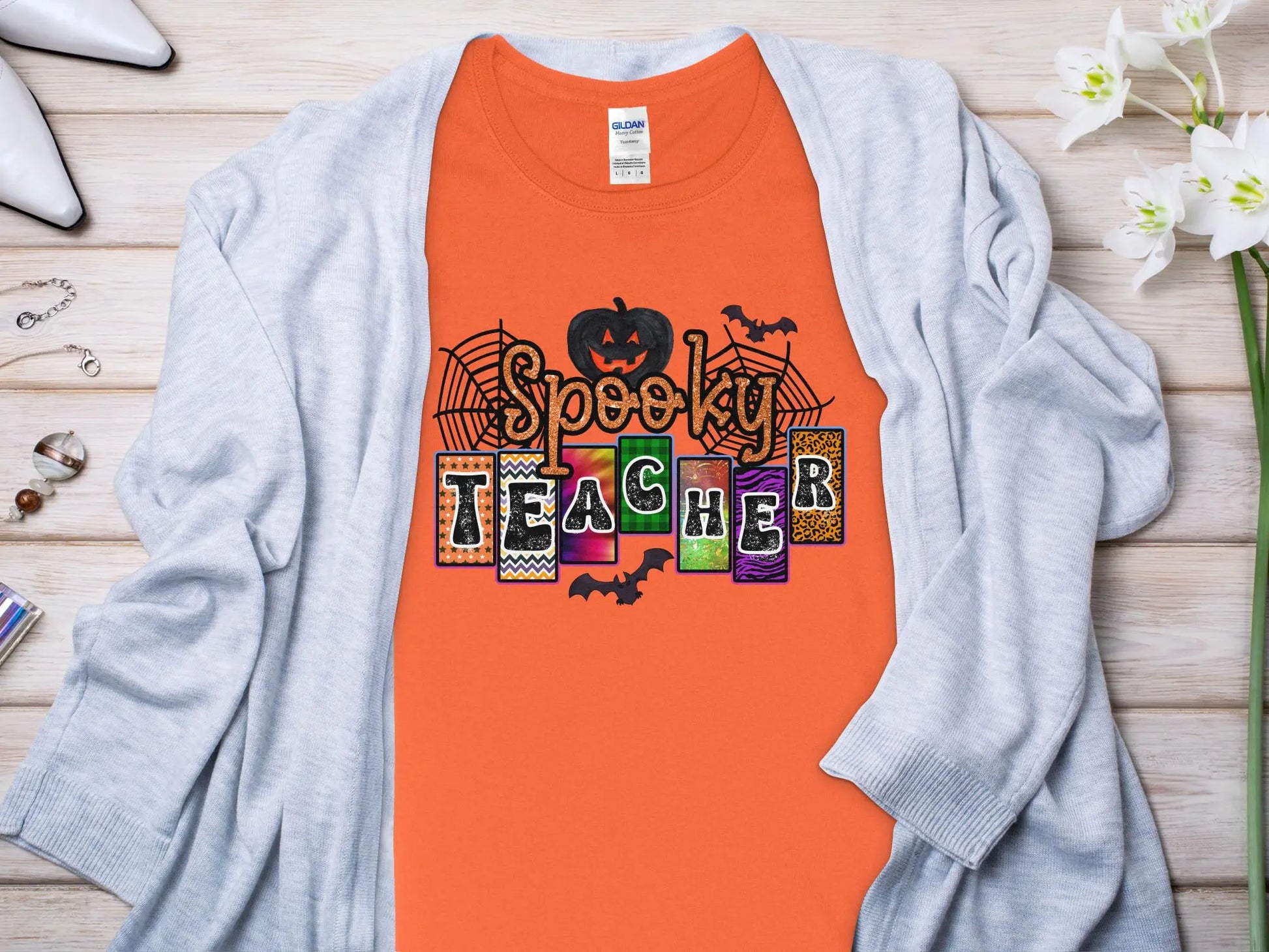 This Halloween Teacher T-Shirt is crafted from high-quality fabric in sizes to fit all shapes and size - Creations Unlimited