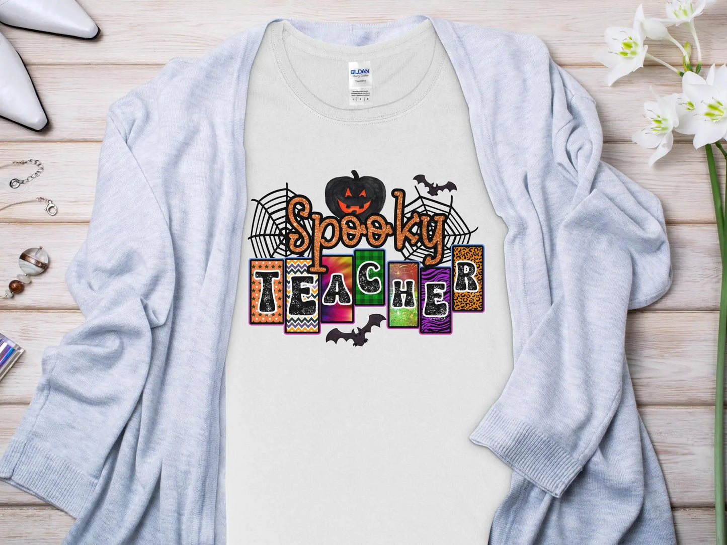 This Halloween Teacher T-Shirt is crafted from high-quality fabric in sizes to fit all shapes and size - Creations Unlimited