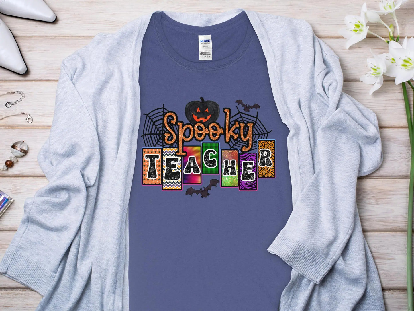 This Halloween Teacher T-Shirt is crafted from high-quality fabric in sizes to fit all shapes and size - Creations Unlimited